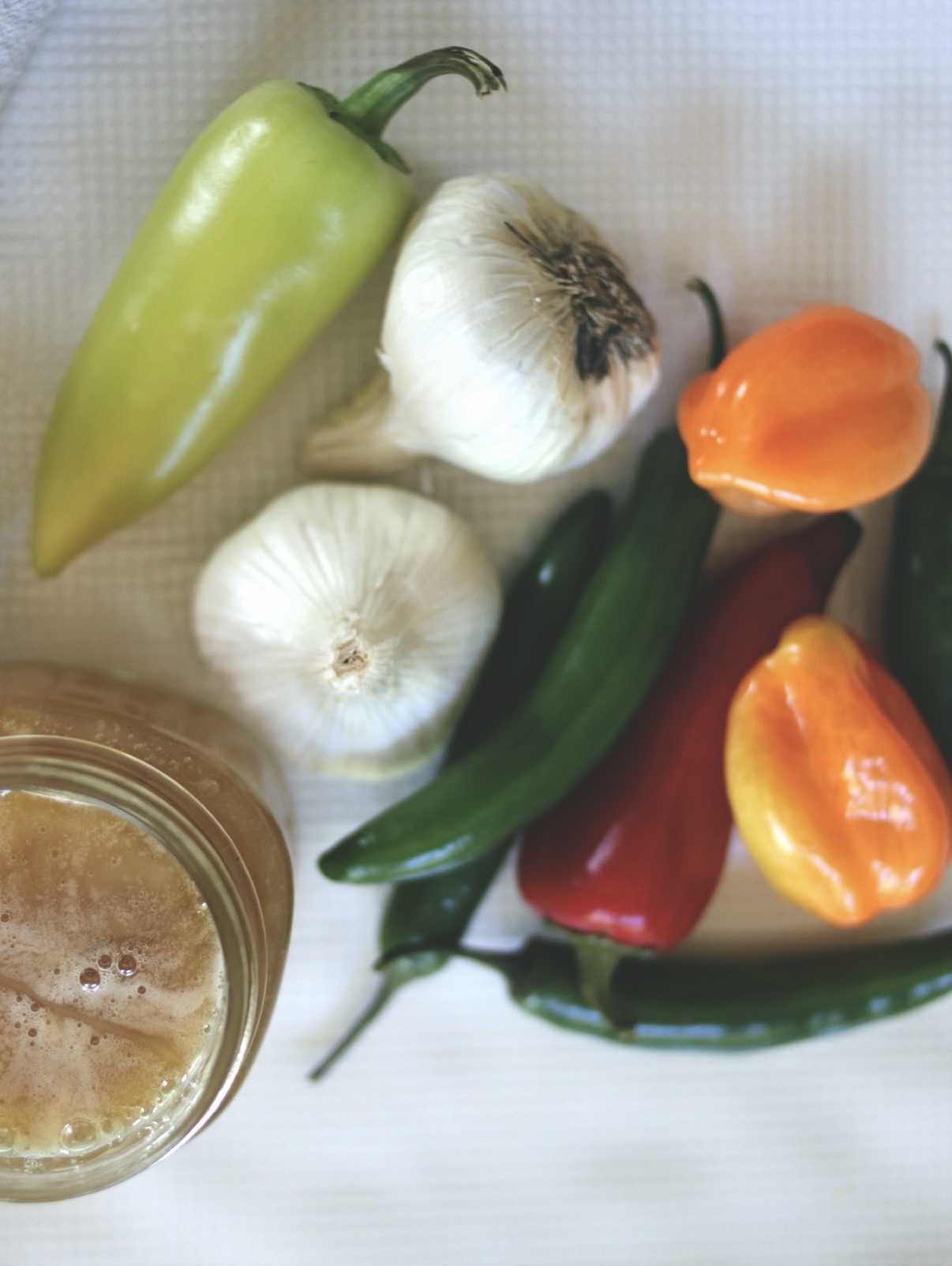 Close-up of sliced peppers and chopped garlic for fermented garlic jalapeño hot honey